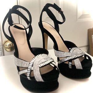 Aldo brand New. Black and Silver Stiletto Heels with Ankle Strap.